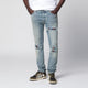 Amiri Mx1 Distressed Flannelpatched Jeans In Medium Indigo